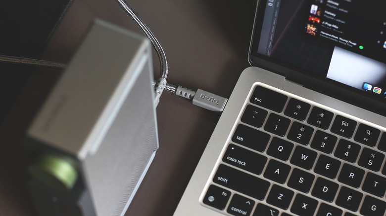 A USB docking station connected to a MacBook