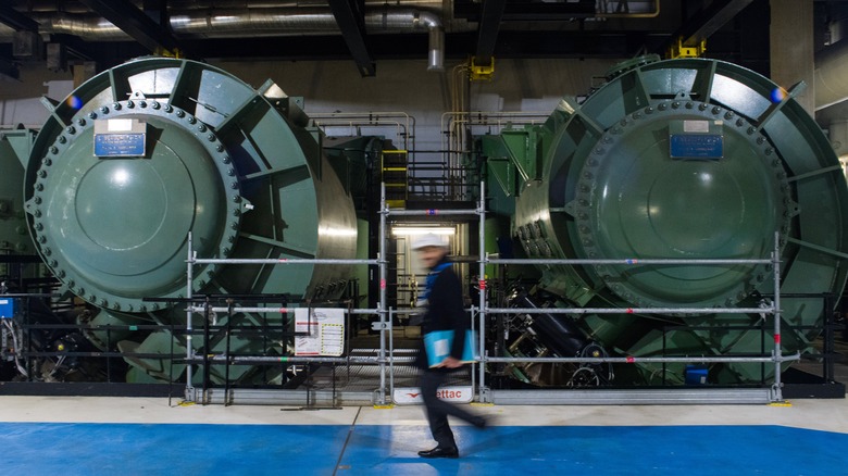 Scientist walking in nuclear facility