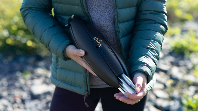 A person holds a Shine Turbine