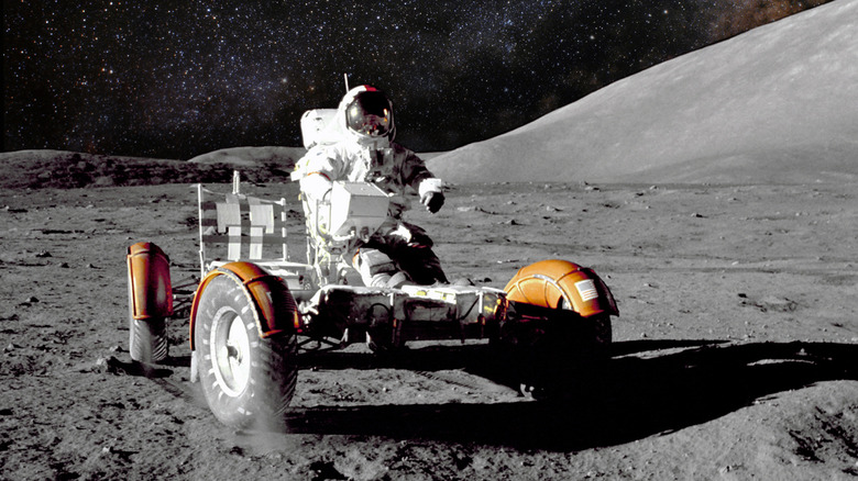 astronaut driving lunar rover