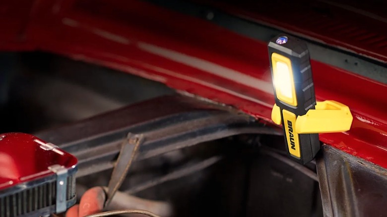 Braun LED light shining on a car engine