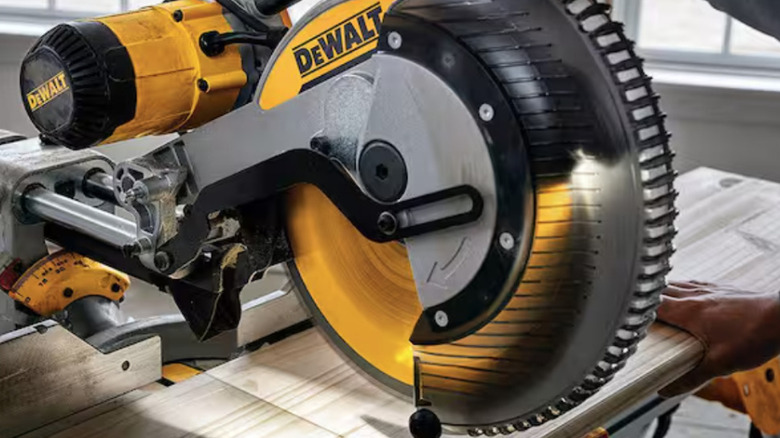 DeWalt miter saw cutting wood