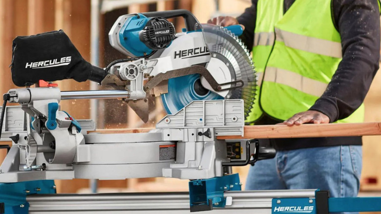 Construction worker using Hercules miter saw