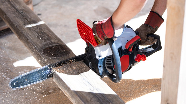 Man using a chainsaw