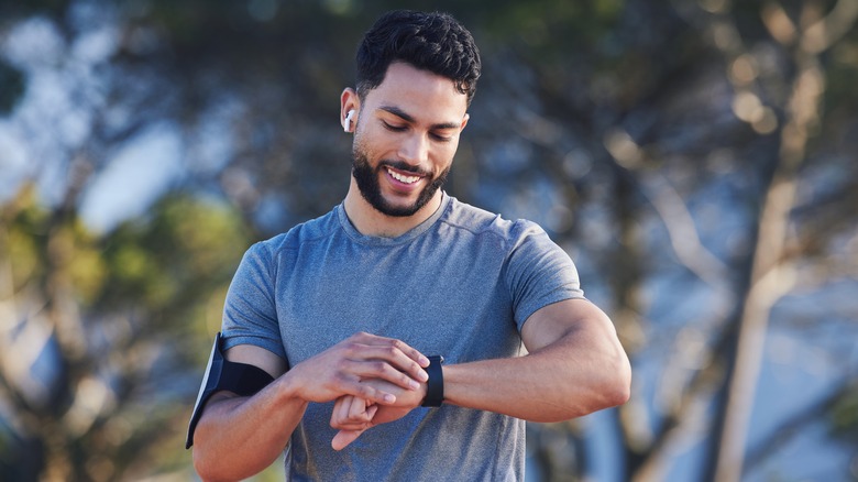 A Person Using A Smart Watch