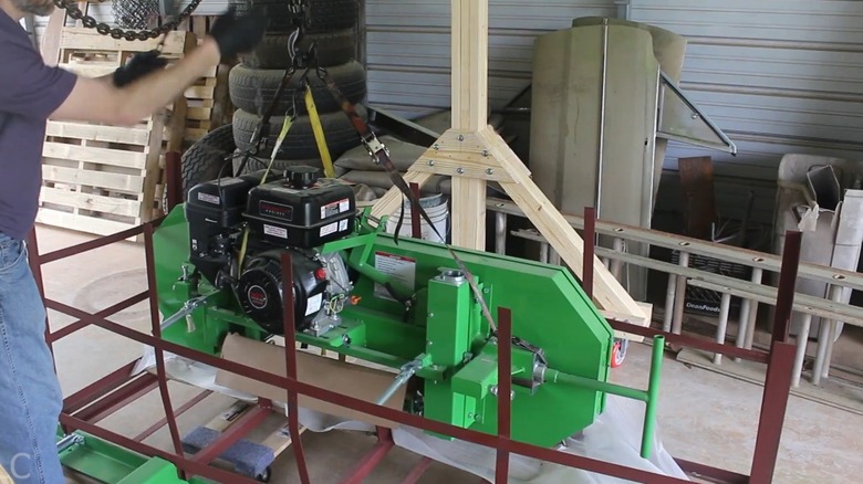 Using a homemade gantry and chain hoist to lift the Harbor Freight sawmill subassembly from its shipping crate.