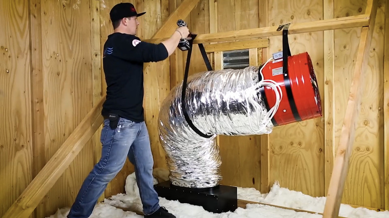 Man installs whole house fan in attic
