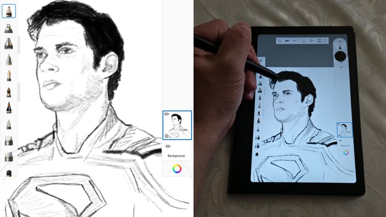 A drawing of Superman on the Huon Note E with a man's hand holding a pen