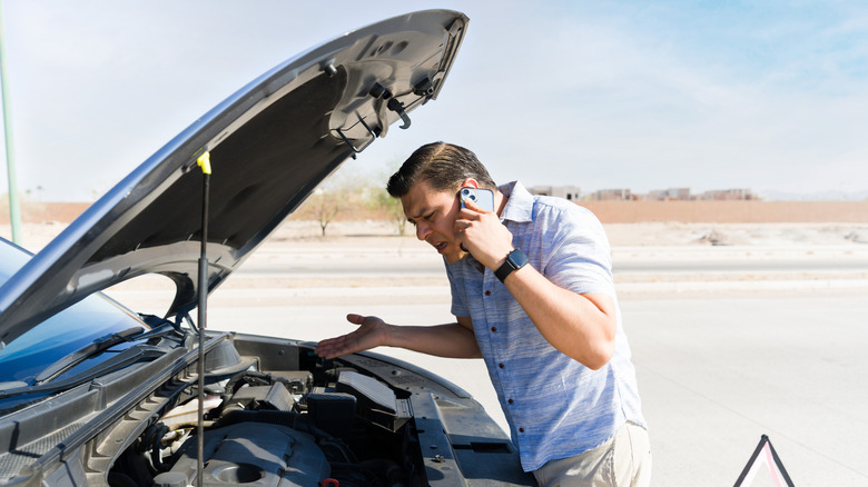 Man having car troubles on the side of the road