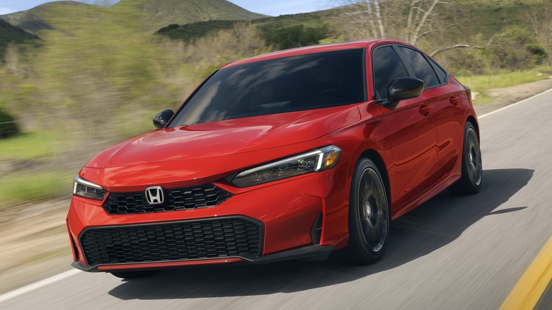 Front 3/4 view of Honda Civic in country setting