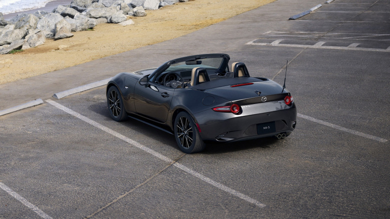 Rear left high view of grey 2024 Mazda Miata in parking lot