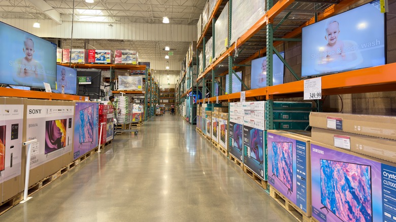 A large display of TVs at a Costco store