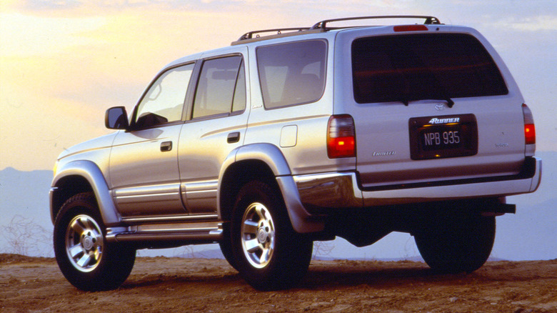 Third-gen Toyota 4Runner parked on a sandy hill, rear 3/4 view
