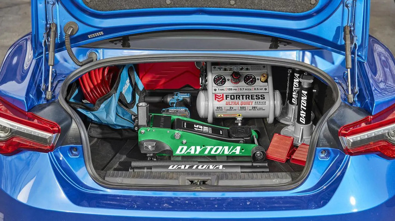 Daytona 1.5 Ton Professional Racing Series Aluminum Floor Jack in the trunk of a Subaru BRZ