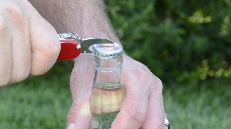 Opening a bottle with the Compact Swiss Army Knife