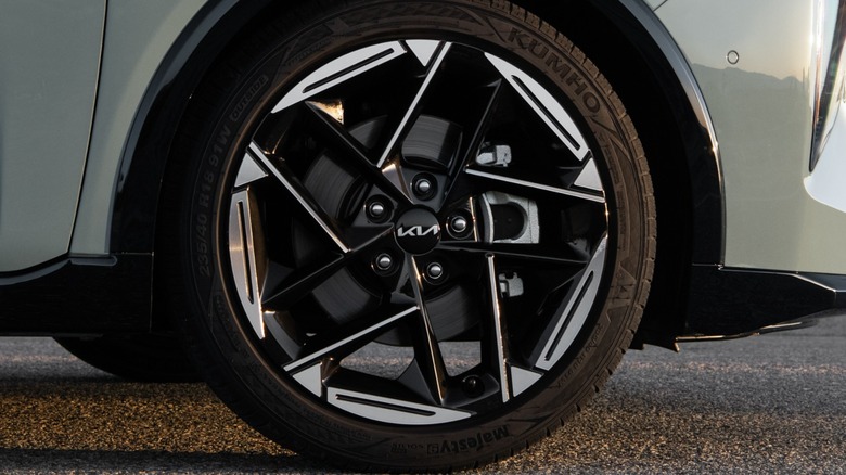 Close-up of Kia logo on Kia K4 wheel