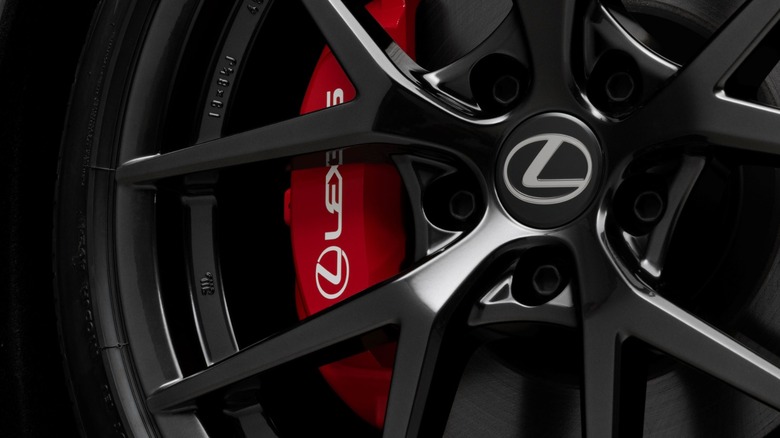 Close-up of Lexus IS 350 wheel showing Lexus logo and red brake caliper.