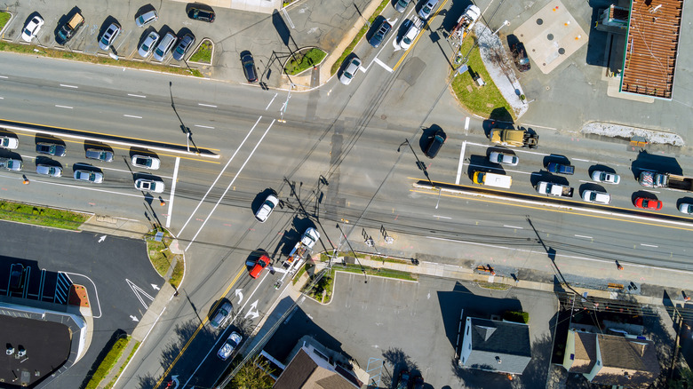 An aerial view of road intersection during rush hour with heavy traffic