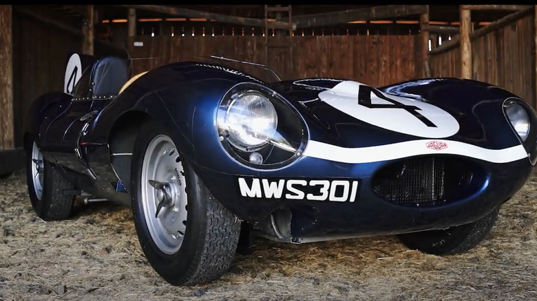 1955 Jaguar D-type parked in barn