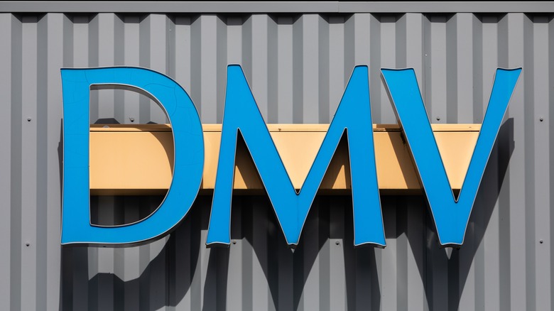 DMV signage on the front entrance of the DMV building.