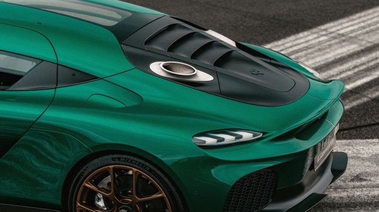 A close-up of the Koenigsegg Gemera's engine cover, showing the top mounted exhausts
