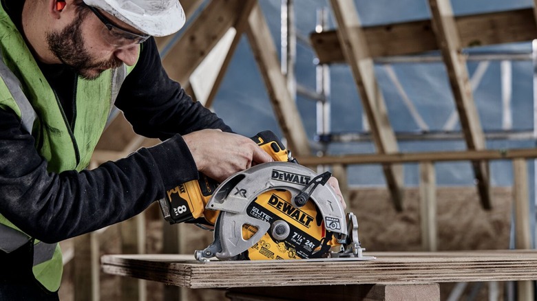 Construction worker using DeWalt power tool