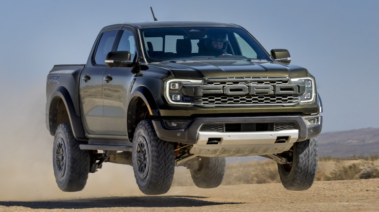 Front 3/4 view of Ford Ranger Raptor in mid-air in desert setting