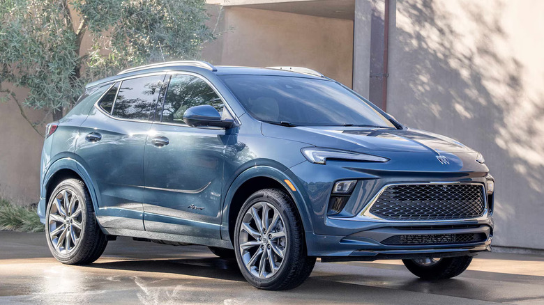 Shot of the 2024 Buick Encore GX in blue parked outside of a home