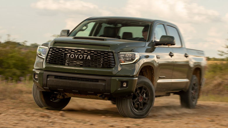 Green 2020 Tundra TRD Pro cornering on dirt