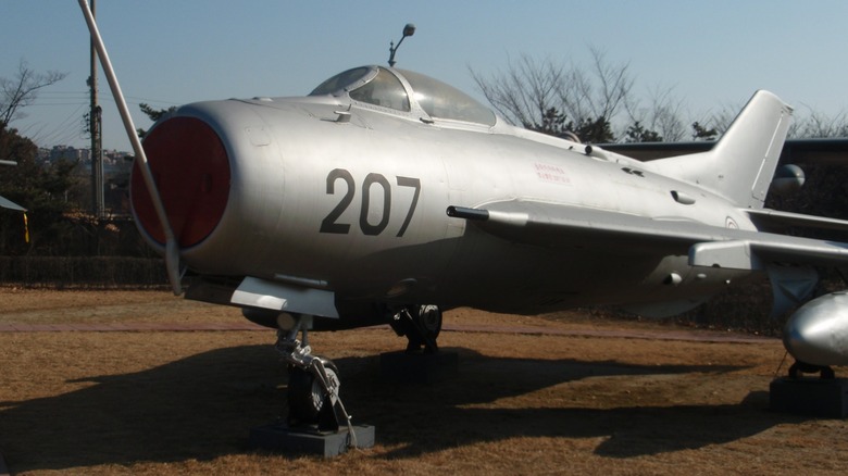 A North Korean Shenyang J-6 parked on grass