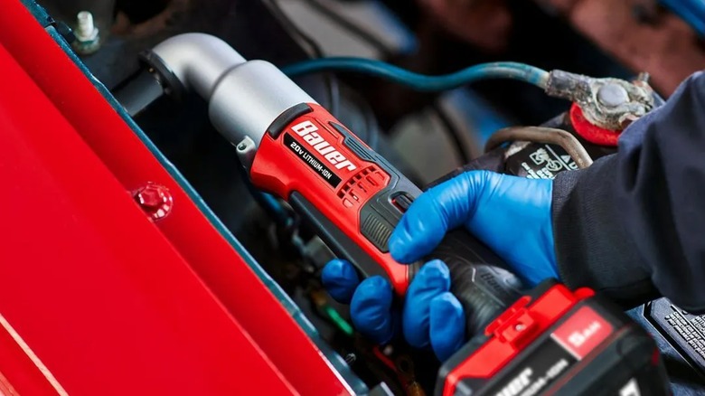 A person using a Bauer right angle impact wrench.