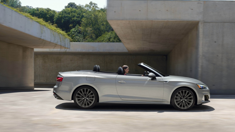 A silver Audi A5 Cabriolet parked in front of a building