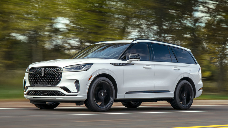 2025 Lincoln Aviator traveling at speed on road, front-left view