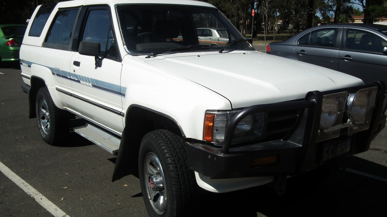 white 1988 Toyota 4Runner in  parking lot on  sunny day