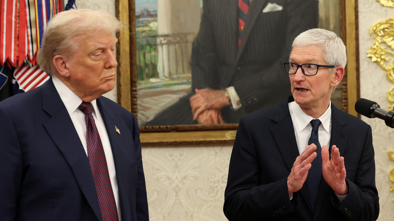 Tim Cook speaks as U.S. President Donald Trump looks on during an event in the Oval Office