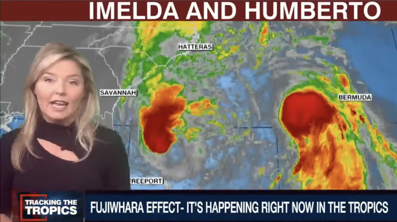 weather woman reports on the hurricanes Humberto and Imelda
