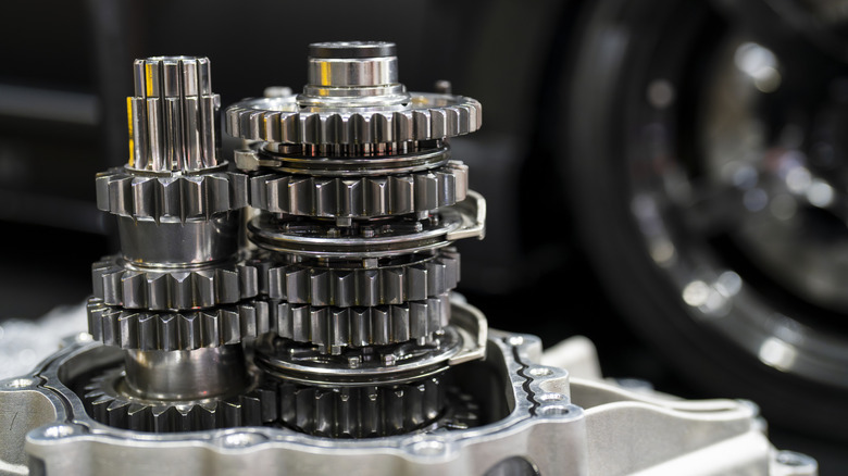 Close-up of car transmission gears sitting on a table.