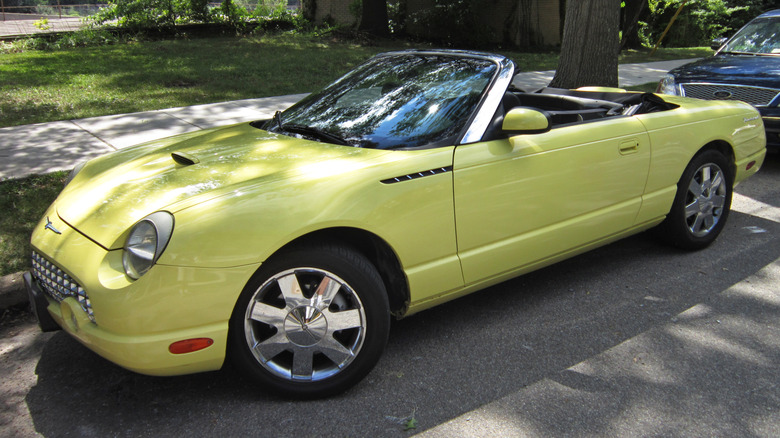 Yellow Ford Thunderbird parked on street