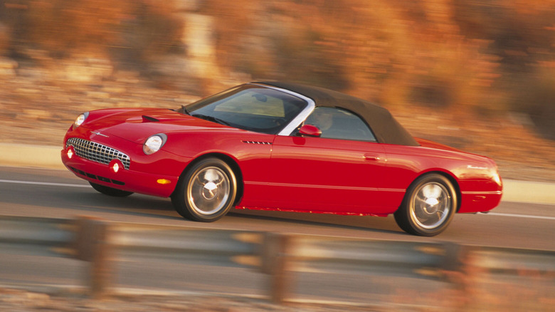 Red Ford Thunderbird on mountain road