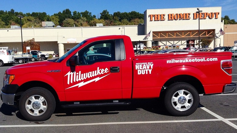 Milwaukee delivery truck parked infront of a Lowe's store
