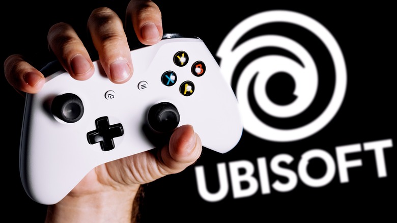 hand holding controller ubisoft logo