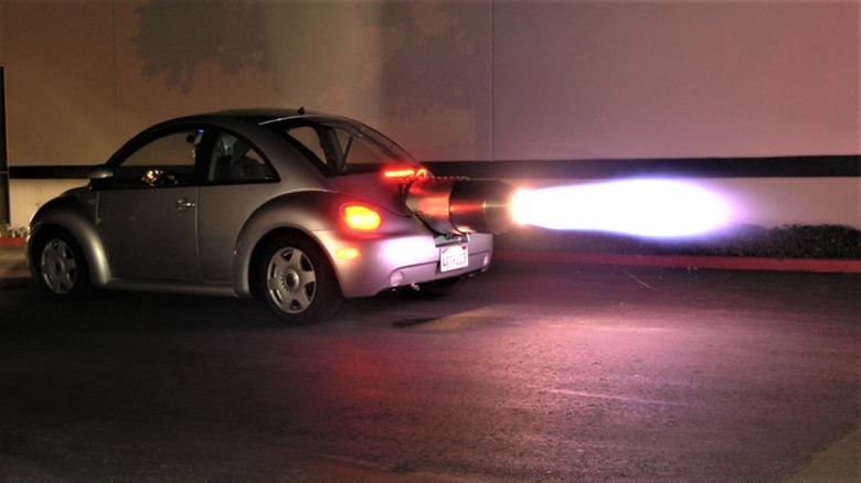Flaming jet powered Beetle on road
