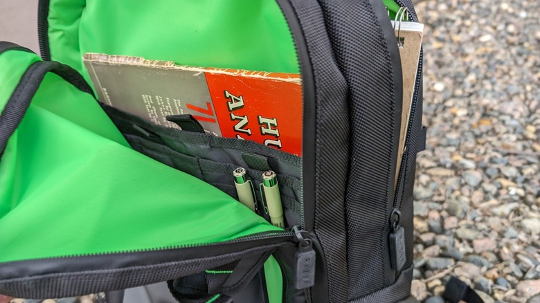 Razer backpack open with books inside
