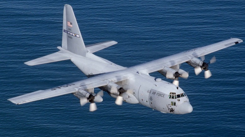 A U.S. Air Force Lockheed C-130 Hercules flying over water