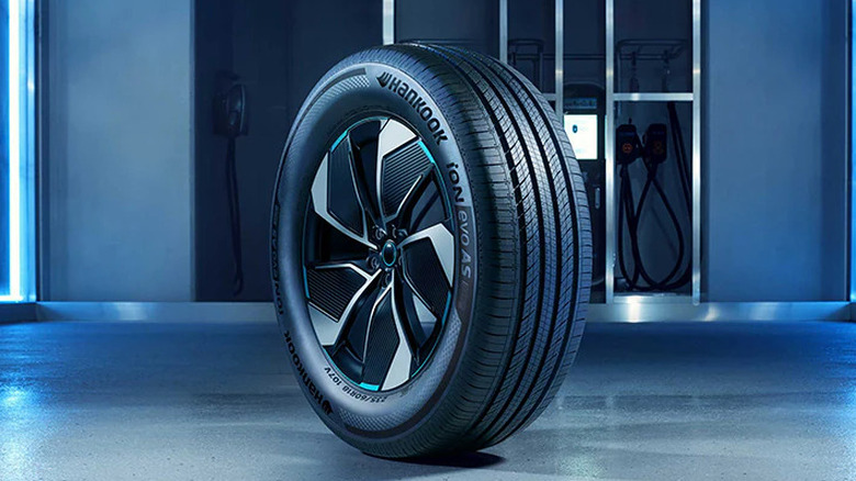 Front three-quarter view of Hankook tire mounted on wheel in a tire store