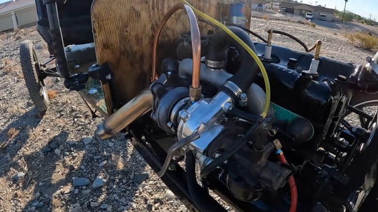 A close up of the turbocharger added to a Model T engine