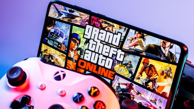Playing Grand Theft Auto on phone with Xbox controller.