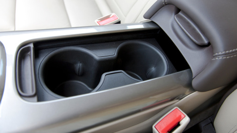 A closeup of a modern cup holder with narrow section in between