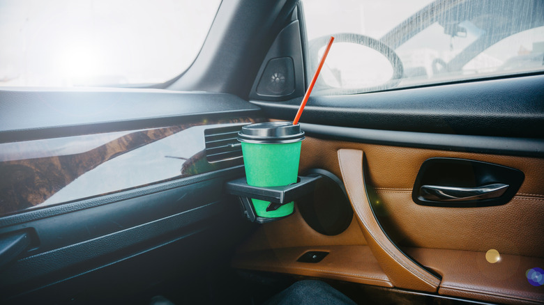A BMW with slide out cup holders on the dashboard
