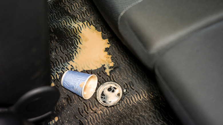 Spilled coffee on the floor of a vehicle
